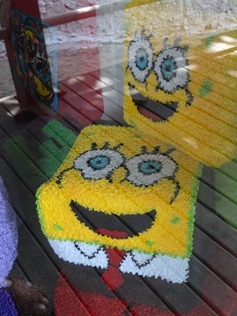 12 Spongebob rugs in store window