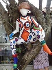 46 sculpture of woman, in tree