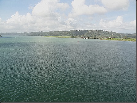 Dam of Chagres river near Gatun.  Far shore is a manmade earthen dam, half a mile thick at its base