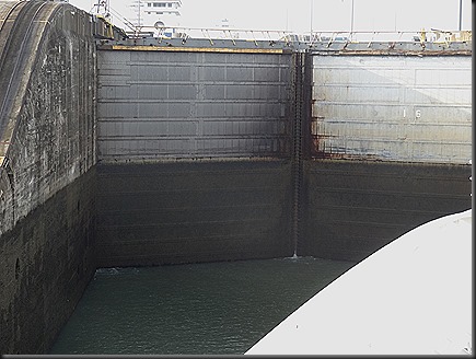 entering lock at Gatun, dark part of lock doors will be underwater when ready to move to next level